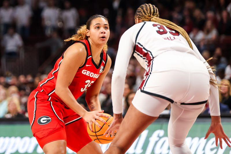 Feb 18, 2024; Columbia, South Carolina, USA; Georgia Lady Bulldogs forward Javyn Nicholson (35) looks to shoot over South Carolina Gamecocks center Sakima Walker (35) in the first half at Colonial Life Arena. Mandatory Credit: Jeff Blake-USA TODAY Sports