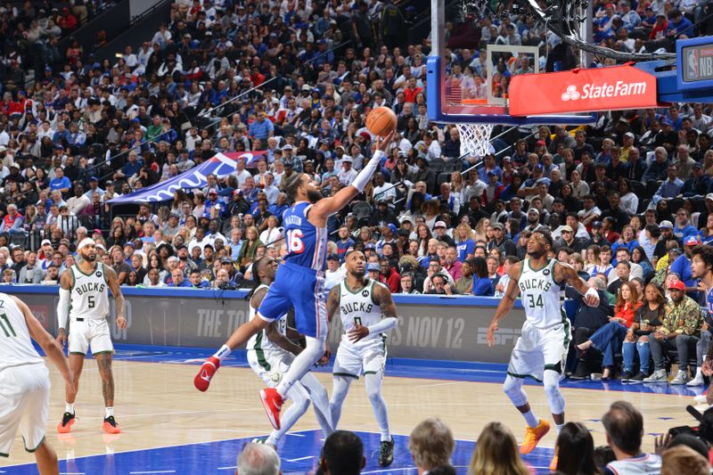 PHILADELPHIA, PA - OCTOBER 23: Caleb Martin #16 of the Philadelphia 76ers drives to the basket during the game against the Milwaukee Bucks on October 23, 2024 at the Wells Fargo Center in Philadelphia, Pennsylvania NOTE TO USER: User expressly acknowledges and agrees that, by downloading and/or using this Photograph, user is consenting to the terms and conditions of the Getty Images License Agreement. Mandatory Copyright Notice: Copyright 2024 NBAE (Photo by Jesse D. Garrabrant/NBAE via Getty Images)