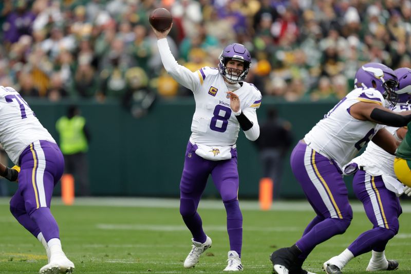 Minnesota Vikings quarterback Kirk Cousins (8) passes during the first half of an NFL football game against the Green Bay Packers, Sunday, Oct. 29, 2023, in Green Bay, Wis. (AP Photo/Matt Ludtke)