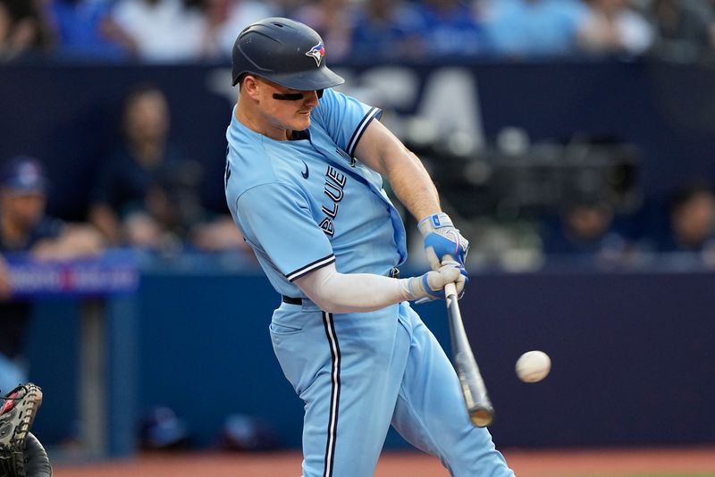 May 30, 2023; Toronto, Ontario, CAN; Toronto Blue Jays third baseman Matt Chapman (26) hits an RBI single against the Milwaukee Brewers during the first inning at Rogers Centre. Mandatory Credit: John E. Sokolowski-USA TODAY Sports