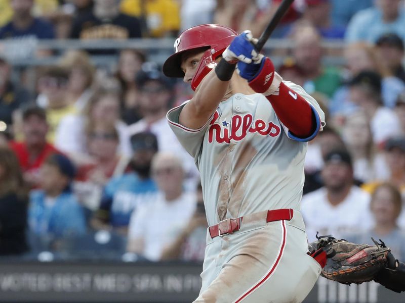 Jul 19, 2024; Pittsburgh, Pennsylvania, USA;  Philadelphia Phillies shortstop Trea Turner (7) hits a two run home run against the Pittsburgh Pirates during the fourth inning at PNC Park. Mandatory Credit: Charles LeClaire-USA TODAY Sports