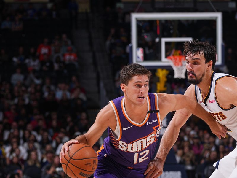 DENVER, CO - OCTOBER 13: Collin Gillespie #12 of the Phoenix Suns drives to the basket during the game against the Denver Nuggets on October 13, 2024 at Ball Arena in Denver, Colorado. NOTE TO USER: User expressly acknowledges and agrees that, by downloading and/or using this Photograph, user is consenting to the terms and conditions of the Getty Images License Agreement. Mandatory Copyright Notice: Copyright 2024 NBAE (Photo by Bart Young/NBAE via Getty Images)