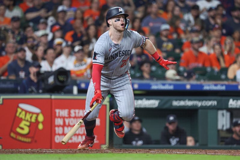 May 31, 2024; Houston, Texas, USA; Minnesota Twins catcher Ryan Jeffers (27) hits a double during the sixth inning against the Houston Astros at Minute Maid Park. Mandatory Credit: Troy Taormina-USA TODAY Sports