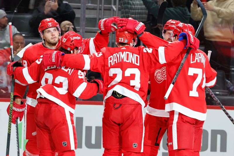 Oct 18, 2023; Detroit, Michigan, USA; Detroit Red Wings defenseman Ben Chiarot (8) receives congratulations from teammates after scoring against the Pittsburgh Penguins at Little Caesars Arena. Mandatory Credit: Rick Osentoski-USA TODAY Sports