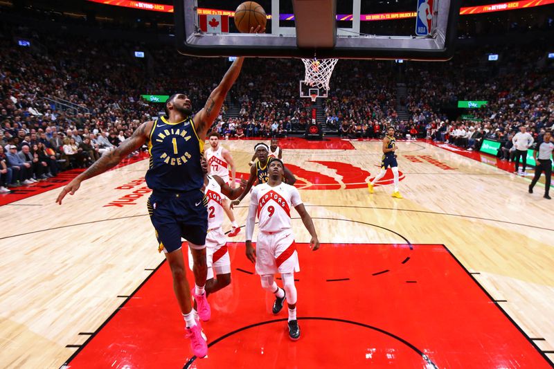 TORONTO, CANADA - NOVEMBER 18: Obi Toppin #1 of the Indiana Pacers drives to the basket during the game against the Toronto Raptors on November 18, 2024 at the Scotiabank Arena in Toronto, Ontario, Canada.  NOTE TO USER: User expressly acknowledges and agrees that, by downloading and or using this Photograph, user is consenting to the terms and conditions of the Getty Images License Agreement.  Mandatory Copyright Notice: Copyright 2024 NBAE (Photo by Vaughn Ridley/NBAE via Getty Images)