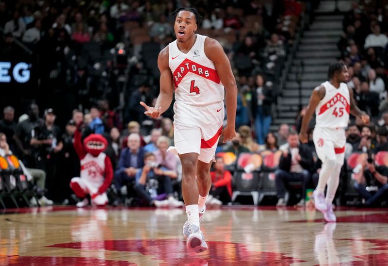 TORONTO, ON - OCTOBER 15: Scottie Barnes #4 of the Toronto Raptors celebrates a a three point shot against the Boston Celtics during the first half of their preseason basketball game at the Scotiabank Arena on October 15, 2024 in Toronto, Ontario, Canada. NOTE TO USER: User expressly acknowledges and agrees that, by downloading and/or using this Photograph, user is consenting to the terms and conditions of the Getty Images License Agreement. (Photo by Mark Blinch/Getty Images)