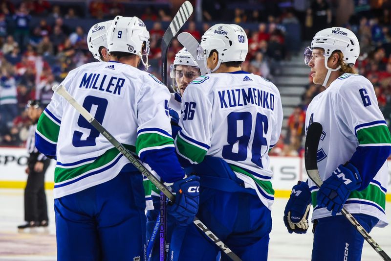 Dec 2, 2023; Calgary, Alberta, CAN; Vancouver Canucks defenseman Quinn Hughes (43) celebrates his goal with teammates against the Calgary Flames during the first period at Scotiabank Saddledome. Mandatory Credit: Sergei Belski-USA TODAY Sports