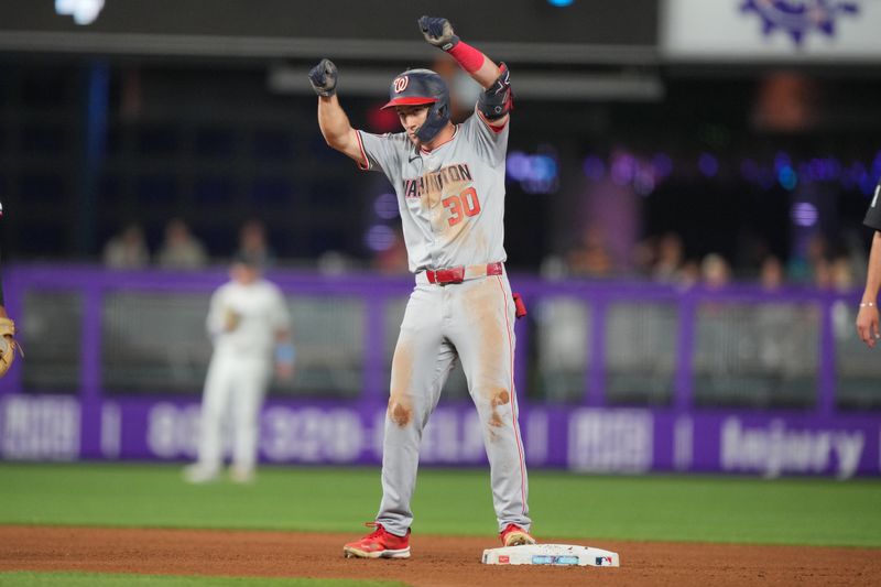 Sep 3, 2024; Miami, Florida, USA;  Washington Nationals center fielder Jacob Young (30) celebrates double in the fourth inning against the Miami Marlins at loanDepot Park. Mandatory Credit: Jim Rassol-Imagn Images.