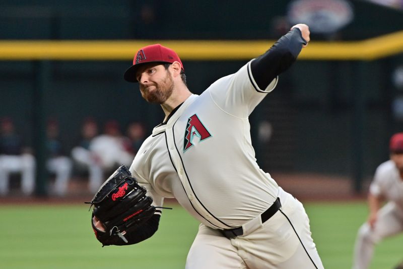 May 1, 2024; Phoenix, Arizona, USA;  Arizona Diamondbacks pitcher Jordan Montgomery (52) throws in the first inning against the Los Angeles Dodgers at Chase Field. Mandatory Credit: Matt Kartozian-USA TODAY Sports