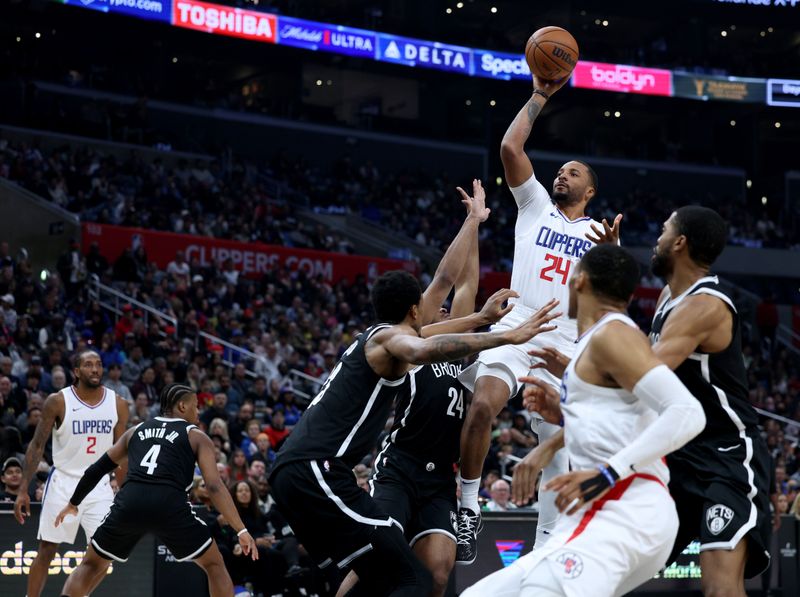 LOS ANGELES, CALIFORNIA - JANUARY 21: Norman Powell #24 of the LA Clippers shoots against the Brooklyn Nets during a 125-114 Clippers win at Crypto.com Arena on January 21, 2024 in Los Angeles, California. User is consenting to the terms and conditions of the Getty Images License Agreement. (Photo by Harry How/Getty Images)