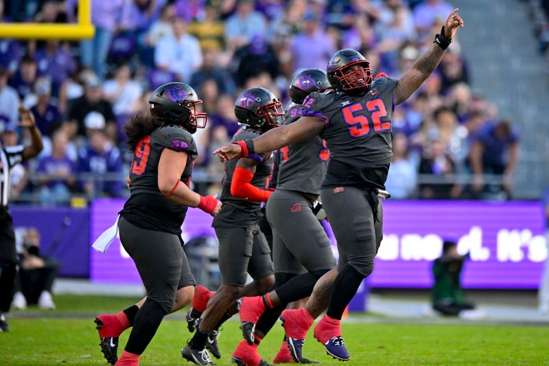 Nov 18, 2023; Fort Worth, Texas, USA; TCU Horned Frogs defensive lineman Damonic Williams (52) and the Frogs defense celebrate after making a defensive stop against the Baylor Bears during the second half at Amon G. Carter Stadium. Mandatory Credit: Jerome Miron-USA TODAY Sports