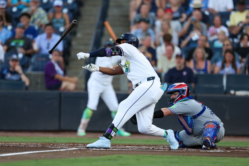 May 24, 2025; Tampa, Florida, USA; Tampa Bay Rays third baseman Junior Caminero (13) looses his bat on a swing against the Toronto Blue Jays in the first inning at George M. Steinbrenner Field. Mandatory Credit: Nathan Ray Seebeck-Imagn Images