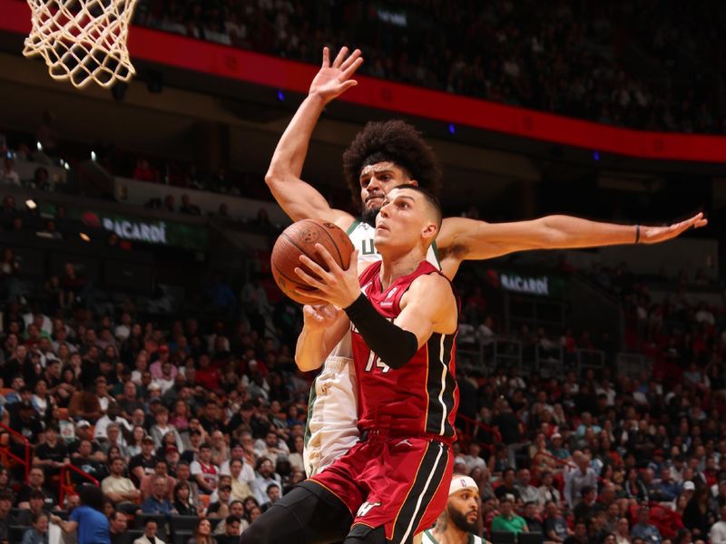 MIAMI, FL - NOVEMBER 26: Tyler Herro #14 of the Miami Heat drives to the basket during the game against the Milwaukee Bucks during the Emirates NBA Cup game on November 26, 2024 at Kaseya Center in Miami, Florida. NOTE TO USER: User expressly acknowledges and agrees that, by downloading and or using this Photograph, user is consenting to the terms and conditions of the Getty Images License Agreement. Mandatory Copyright Notice: Copyright 2024 NBAE (Photo by Issac Baldizon/NBAE via Getty Images)