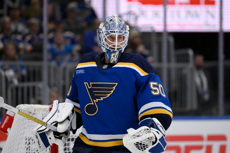 Oct 15, 2024; St. Louis, Missouri, USA; St. Louis Blues goaltender Jordan Binnington (50) looks on during the first period of a hockey game against the Minnesota Wild at Enterprise Center. Mandatory Credit: Jeff Le-Imagn Images