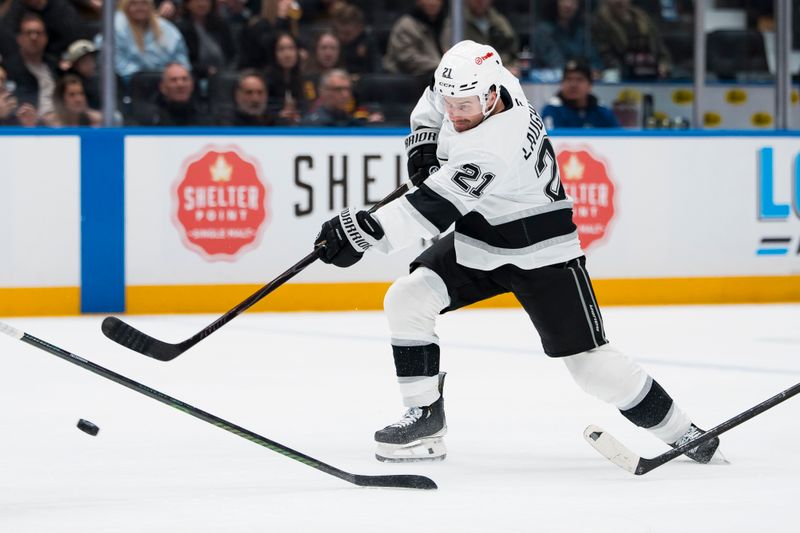 Mar 26, 2026; Vancouver, British Columbia, CAN; Los Angeles Kings forward Scott Laughton (21) shoots against the Vancouver Canucks in the first period at Rogers Arena. Mandatory Credit: Bob Frid-Imagn Images
