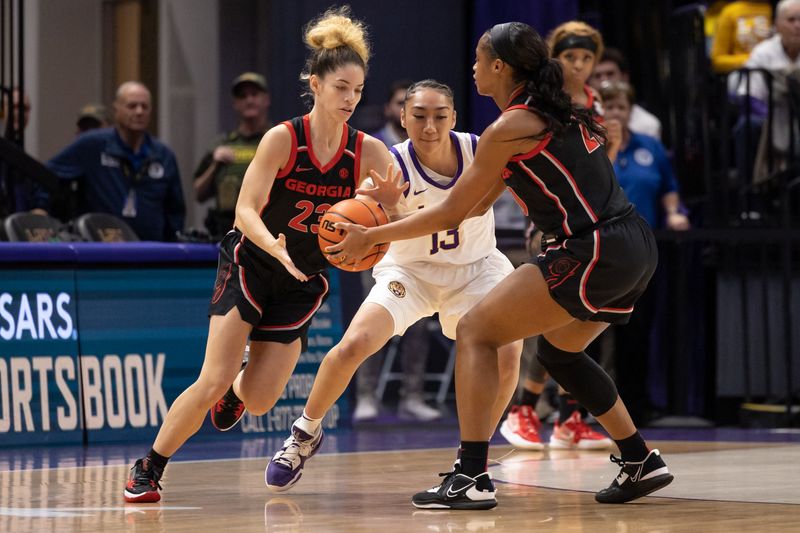 Feb 2, 2023; Baton Rouge, Louisiana, USA;  Georgia Lady Bulldogs forward Jordan Isaacs (20) passes to guard Alisha Lewis (23) against LSU Lady Tigers guard Last-Tear Poa (13) during the first half at Pete Maravich Assembly Center. Mandatory Credit: Stephen Lew-USA TODAY Sports