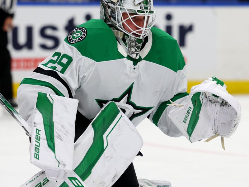 Oct 22, 2024; Buffalo, New York, USA;  Dallas Stars goaltender Jake Oettinger (29) looks for the puck during the second period against the Buffalo Sabres at KeyBank Center. Mandatory Credit: Timothy T. Ludwig-Imagn Images