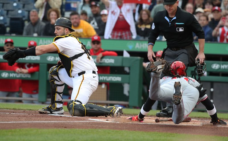 May 19, 2025; Pittsburgh, Pennsylvania, USA;  Pittsburgh Pirates catcher Joey Bart (14) takes a late throw as Cincinnati Reds shortstop Elly De La Cruz (44) slides home to score a run during the first inning at PNC Park. Mandatory Credit: Charles LeClaire-Imagn Images