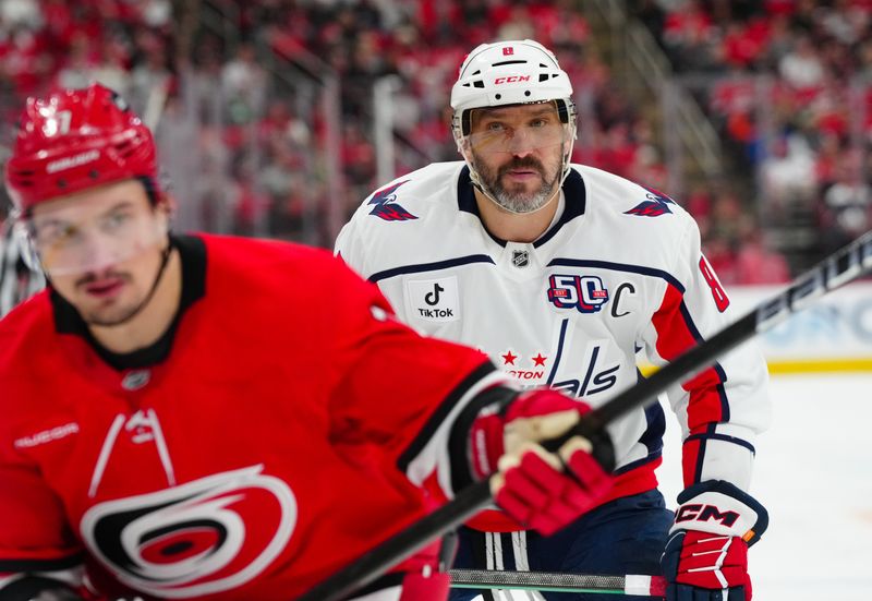 Apr 2, 2025; Raleigh, North Carolina, USA;  Washington Capitals left wing Alex Ovechkin (8) watches the play against the Carolina Hurricanes during the second period at Lenovo Center. Mandatory Credit: James Guillory-Imagn Images