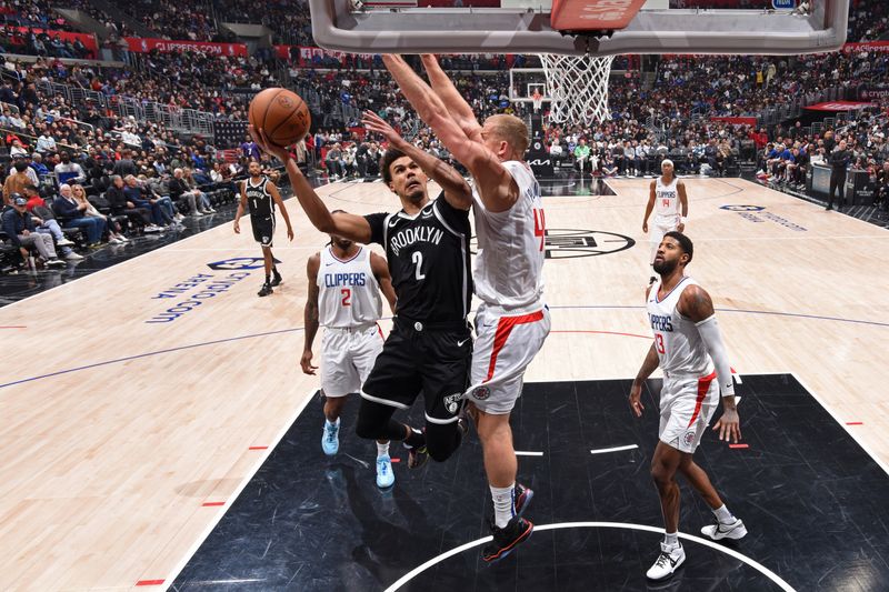 LOS ANGELES, CA - JANUARY 21: Cameron Johnson #2 of the Brooklyn Nets drives to the basket during the game against the LA Clippers on January 21, 2024 at Crypto.Com Arena in Los Angeles, California. NOTE TO USER: User expressly acknowledges and agrees that, by downloading and/or using this Photograph, user is consenting to the terms and conditions of the Getty Images License Agreement. Mandatory Copyright Notice: Copyright 2024 NBAE (Photo by Adam Pantozzi/NBAE via Getty Images)