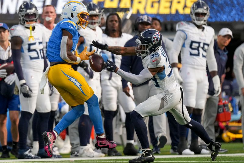 Tennessee Titans cornerback Darrell Baker Jr. (39) breaks up a pass intended for Los Angeles Chargers wide receiver Joshua Palmer (5) during the first half of an NFL football game Sunday, Nov. 10, 2024, in Inglewood, Calif. (AP Photo/Mark J. Terrill)