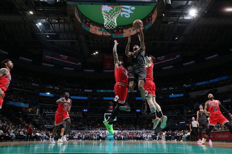 WASHINGTON, DC -? APRIL 12: Jared Butler #4 of the Washington Wizards shoots the ball during the game against the Chicago Bulls on April 12, 2024 at Capital One Arena in Washington, DC. NOTE TO USER: User expressly acknowledges and agrees that, by downloading and or using this Photograph, user is consenting to the terms and conditions of the Getty Images License Agreement. Mandatory Copyright Notice: Copyright 2024 NBAE (Photo by Stephen Gosling/NBAE via Getty Images)