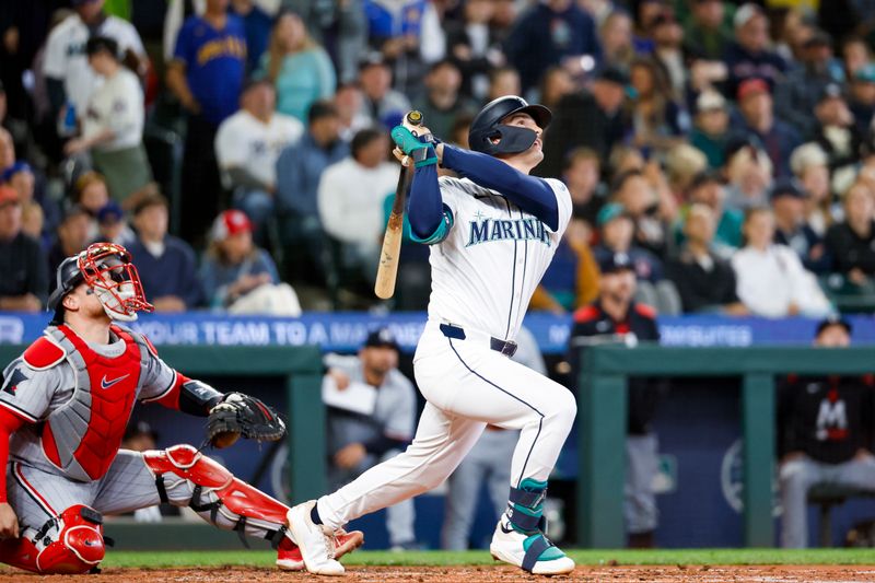 May 31, 2025; Seattle, Washington, USA; Seattle Mariners second baseman Cole Young (2) flies out during his first major league at bat during the second inning against the Minnesota Twins at T-Mobile Park. Minnesota Twins catcher Christian Vazquez (8) crouches at left. Mandatory Credit: Joe Nicholson-Imagn Images