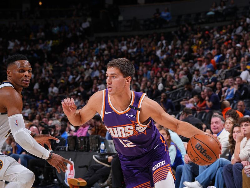 DENVER, CO - OCTOBER 13: Collin Gillespie #12 of the Phoenix Suns drives to the basket during the game against the Denver Nuggets on October 13, 2024 at Ball Arena in Denver, Colorado. NOTE TO USER: User expressly acknowledges and agrees that, by downloading and/or using this Photograph, user is consenting to the terms and conditions of the Getty Images License Agreement. Mandatory Copyright Notice: Copyright 2024 NBAE (Photo by Garrett Ellwood/NBAE via Getty Images)