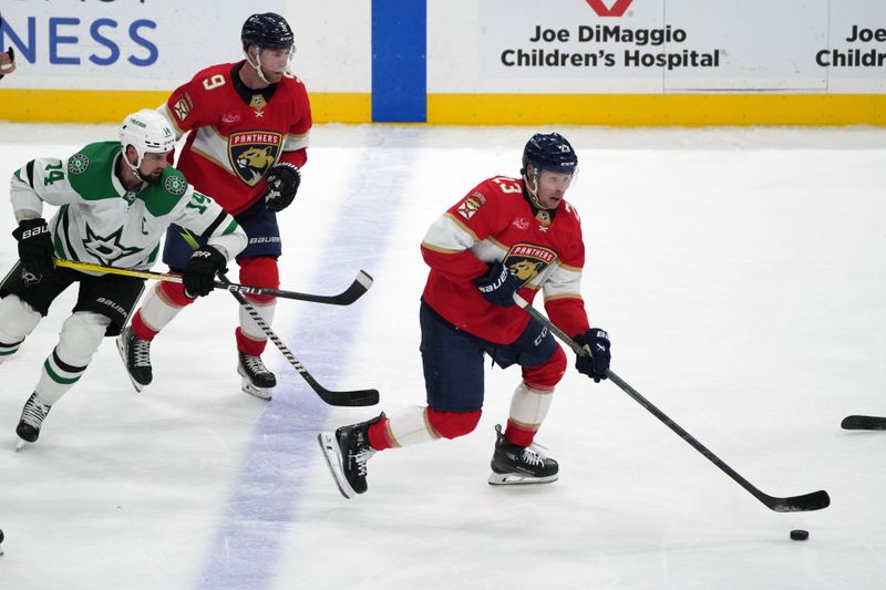 Dec 6, 2023; Sunrise, Florida, USA; Florida Panthers center Carter Verhaeghe (23) brings the puck up the ice against the Dallas Stars during the third period at Amerant Bank Arena. Mandatory Credit: Jim Rassol-USA TODAY Sports