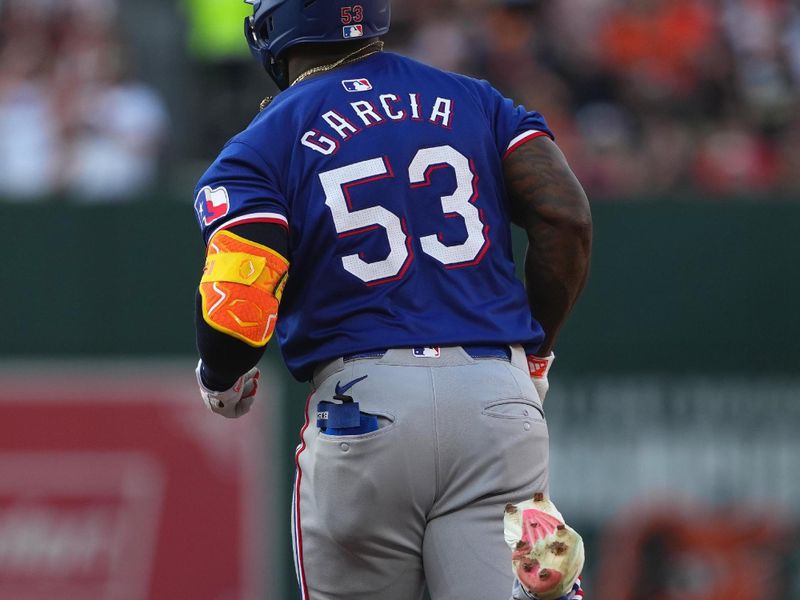 Jun 27, 2024; Baltimore, Maryland, USA; Texas Rangers outfielder Adolis Garcia (53) rounds the bases following his solo home run in the fourth inning against the Baltimore Orioles at Oriole Park at Camden Yards. Mandatory Credit: Mitch Stringer-USA TODAY Sports