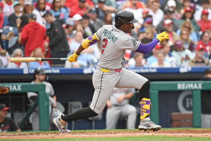 May 4, 2025; Philadelphia, Pennsylvania, USA; Arizona Diamondbacks shortstop Geraldo Perdomo (2) hits an RBI double during the third inning against the Philadelphia Phillies at Citizens Bank Park. Mandatory Credit: Eric Hartline-Imagn Images