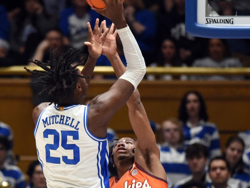 Feb 25, 2023; Durham, North Carolina, USA;  Duke Blue Devils forward Mark Mitchell (25) shoots over Virginia Tech Hokies guard MJ Collins (2) during the first half at Cameron Indoor Stadium. Mandatory Credit: Rob Kinnan-USA TODAY Sports