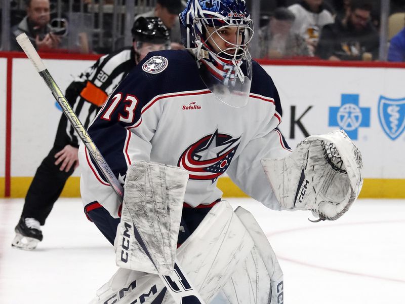 Mar 5, 2024; Pittsburgh, Pennsylvania, USA; Columbus Blue Jackets goaltender Jet Greaves (73)  guards the net against the Pittsburgh Penguins during the third period at PPG Paints Arena. The Penguins won 5-3. Mandatory Credit: Charles LeClaire-USA TODAY Sports