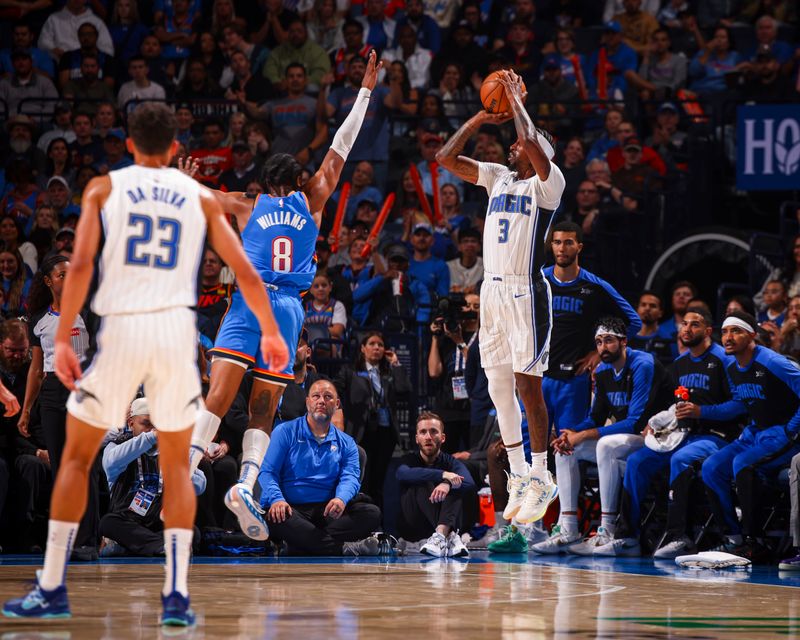 OKLAHOMA CITY, OK - NOVEMBER 4:  Kentavious Caldwell-Pope #3 of the Orlando Magic shoots a three point basket during the game against the Oklahoma City Thunder on November 4, 2024 at Paycom Center in Oklahoma City, Oklahoma. NOTE TO USER: User expressly acknowledges and agrees that, by downloading and or using this photograph, User is consenting to the terms and conditions of the Getty Images License Agreement. Mandatory Copyright Notice: Copyright 2024 NBAE (Photo by Zach Beeker/NBAE via Getty Images)