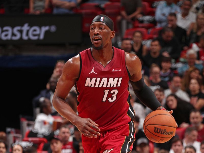 MIAMI, FL - MARCH 10: Bam Adebayo #13 of the Miami Heat brings the ball up court during the game against the Washington Wizards on March 10, 2024 at Kaseya Center in Miami, Florida. NOTE TO USER: User expressly acknowledges and agrees that, by downloading and or using this Photograph, user is consenting to the terms and conditions of the Getty Images License Agreement. Mandatory Copyright Notice: Copyright 2024 NBAE (Photo by Issac Baldizon/NBAE via Getty Images)