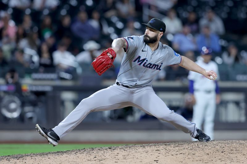 Jun 11, 2024; New York City, New York, USA; Miami Marlins relief pitcher Tanner Scott (66) pitches against the New York Mets during the ninth inning at Citi Field. Mandatory Credit: Brad Penner-USA TODAY Sports