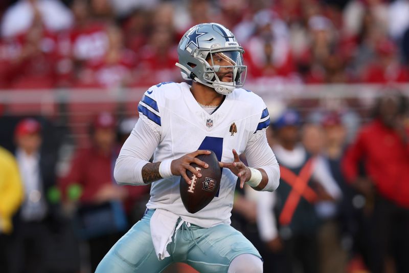 Dallas Cowboys quarterback Dak Prescott (4) drops back to pass against the San Francisco 49ers during the first half of an NFL football game in Santa Clara, Calif., Sunday, Oct. 8, 2023. (AP Photo/Jed Jacobsohn)