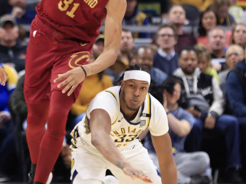 INDIANAPOLIS, INDIANA - MARCH 18: Jarrett Allen #31 of the Cleveland Cavaliers takes control of the ball against Myles Turner #33 of the Indiana Pacers during the first half at Gainbridge Fieldhouse on March 18, 2024 in Indianapolis, Indiana. NOTE TO USER: User expressly acknowledges and agrees that, by downloading and or using this photograph, User is consenting to the terms and conditions of the Getty Images License Agreement. (Photo by Justin Casterline/Getty Images)