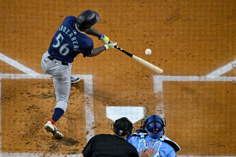 Sep 22, 2024; Arlington, Texas, USA; Seattle Mariners left fielder Randy Arozarena (56) bats against the Texas Rangers during the first inning at Globe Life Field. Mandatory Credit: Jerome Miron-Imagn Images