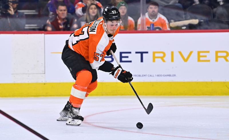 Jan 22, 2023; Philadelphia, Pennsylvania, USA; Philadelphia Flyers right wing Wade Allison (57) reaches for the puck against the Winnipeg Jets in the second period at Wells Fargo Center. Mandatory Credit: Kyle Ross-USA TODAY Sports