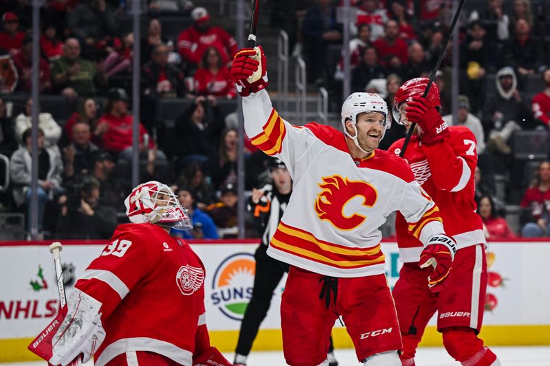 Nov 27, 2024; Detroit, Michigan, USA; Calgary Flames center Jonathan Huberdeau (10) celebrates after the goal of center Connor Zary (not pictured) during the third period against the Detroit Red Wings at Little Caesars Arena. Mandatory Credit: Tim Fuller-Imagn Images