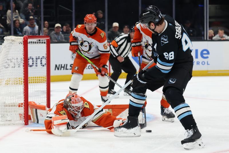 Mar 20, 2026; Salt Lake City, Utah, USA; Utah Mammoth defenseman Mikhail Sergachev (98) looks to shoot a deflection off of Anaheim Ducks goaltender Lukas Dostal (1) during the second period at Delta Center. Mandatory Credit: Rob Gray-Imagn Images
