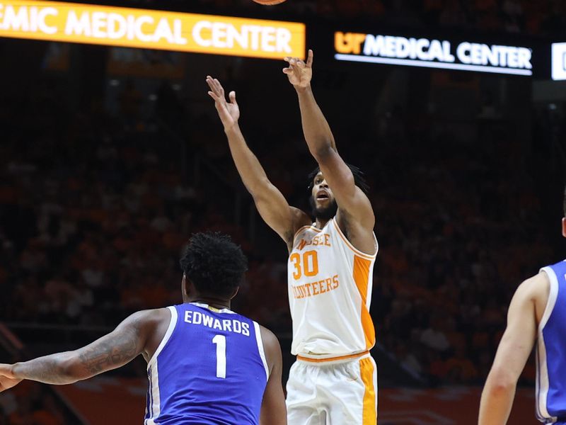 Mar 9, 2024; Knoxville, Tennessee, USA; Tennessee Volunteers guard Josiah-Jordan James (30) shoots a three pointer against the Kentucky Wildcats during the second half at Thompson-Boling Arena at Food City Center. Mandatory Credit: Randy Sartin-USA TODAY Sports