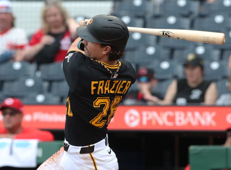 May 21, 2025; Pittsburgh, Pennsylvania, USA;  Pittsburgh Pirates second baseman Adam Frazier (26) hits an RBI single against the Cincinnati Reds during the eighth inning at PNC Park. Mandatory Credit: Charles LeClaire-Imagn Images