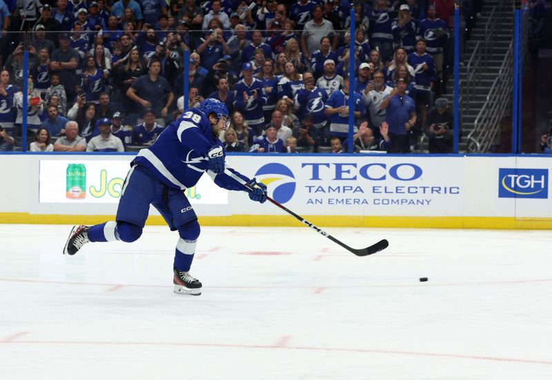 Oct 10, 2023; Tampa, Florida, USA; Tampa Bay Lightning left wing Brandon Hagel (38) scores a goal on a penalty  shot during the third period against the Nashville Predators at Amalie Arena. Mandatory Credit: Kim Klement Neitzel-USA TODAY Sports