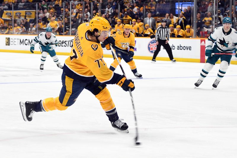 Mar 19, 2024; Nashville, Tennessee, USA; Nashville Predators right wing Luke Evangelista (77) shoots the puck during the first period against the San Jose Sharks at Bridgestone Arena. Mandatory Credit: Christopher Hanewinckel-USA TODAY Sports