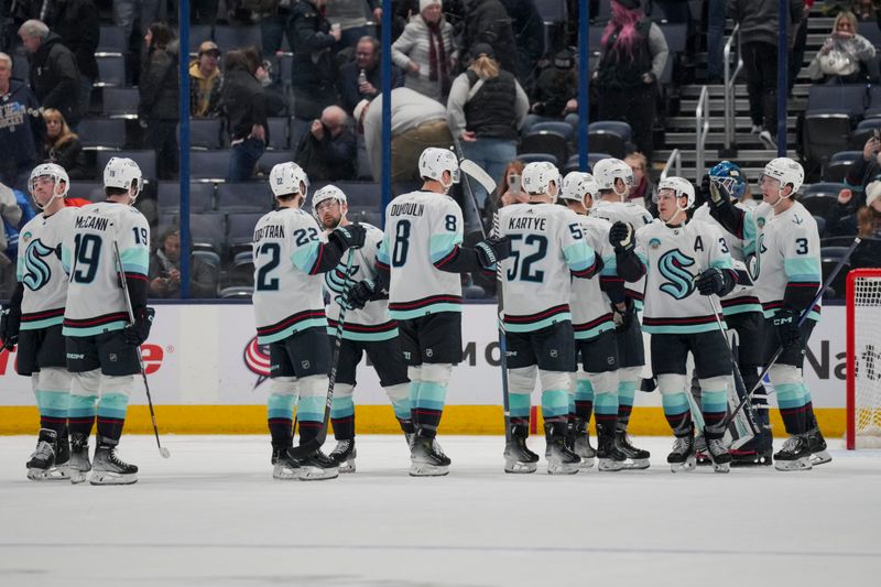 cJan 13, 2024; Columbus, Ohio, USA;  The Seattle Kraken celebrate on the ice after defeating the Columbus Blue Jackets at Nationwide Arena. Mandatory Credit: Aaron Doster-USA TODAY Sports