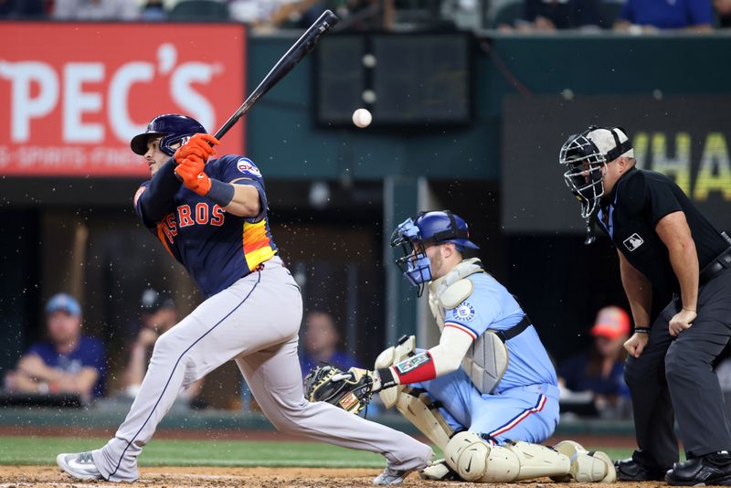May 18, 2025; Arlington, Texas, USA; Houston Astros catcher Yainer Diaz (21) hits a foul ball against the Texas Rangers during the seventh inningi at Globe Life Field. Mandatory Credit: Tim Heitman-Imagn Images