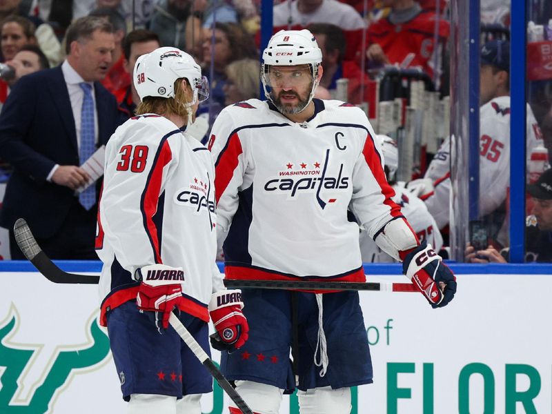 Feb 22, 2024; Tampa, Florida, USA;  Washington Capitals left wing Alex Ovechkin (8) and defenseman Rasmus Sandin (38) talk during a break in play against the Tampa Bay Lightning in the second period at Amalie Arena. Mandatory Credit: Nathan Ray Seebeck-USA TODAY Sports