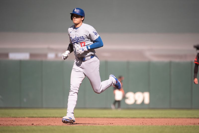 Jun 29, 2024; San Francisco, California, USA; Los Angeles Dodgers two-way player Shohei Ohtani (17) rounds the bases after hitting a home run against the San Francisco Giants during the third inning at Oracle Park. Mandatory Credit: Ed Szczepanski-USA TODAY Sports